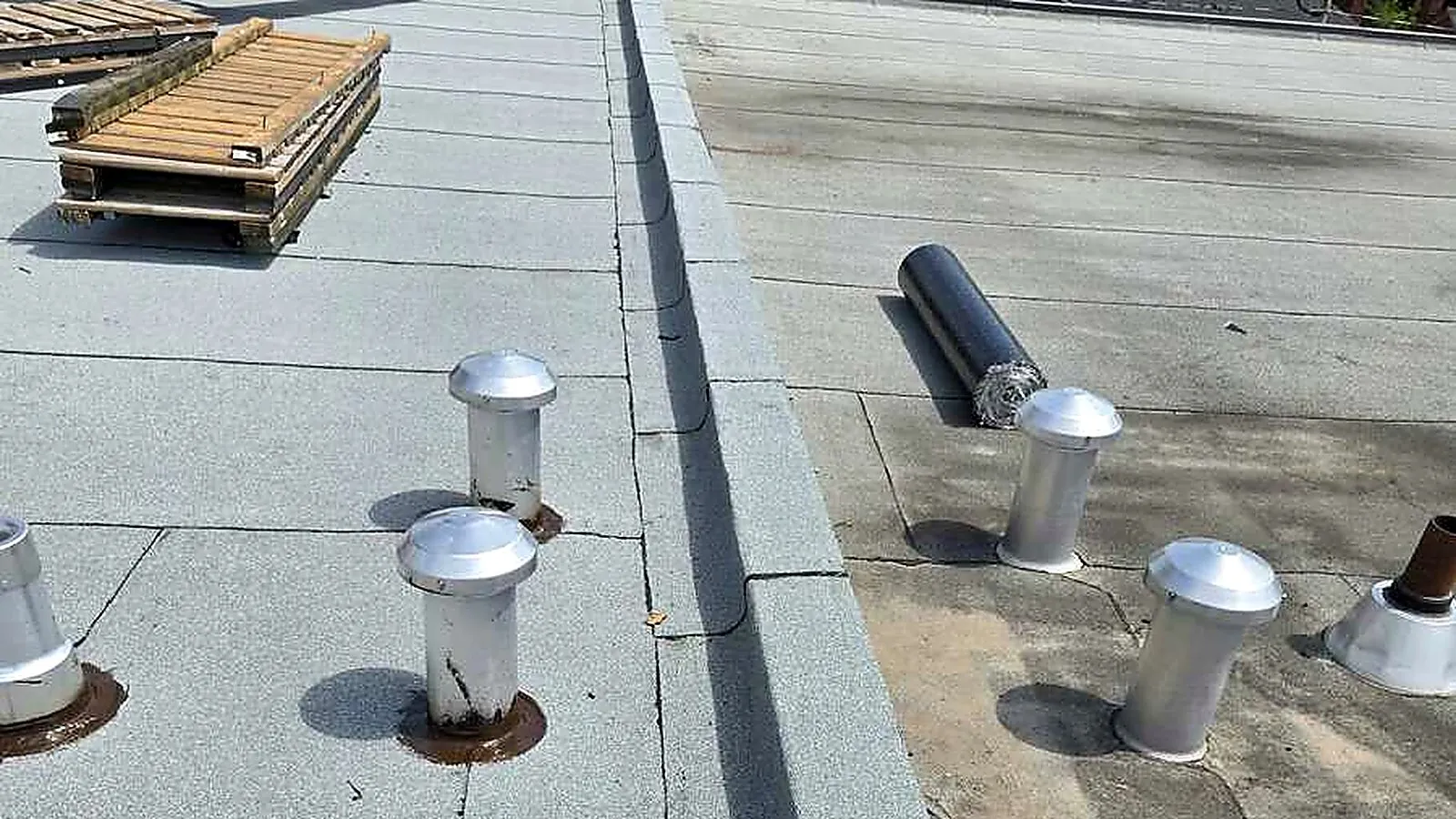 Roof drains and vent stacks on a commercial flat roof